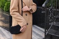 Fashionable woman with stylish bag on city street, closeup. Space for text Royalty Free Stock Photo