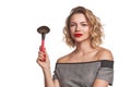 Fashionable woman stylist standing posing with makeup brush Royalty Free Stock Photo