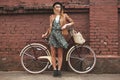 Fashionable woman with vintage bike