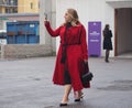 MILAN - FEBRUARY 22, 2018: Fashionable woman walking in the street before LES COPINS fashion show Royalty Free Stock Photo