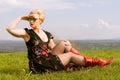 Fashionable woman wearing dress and shades looking far away Royalty Free Stock Photo