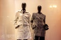 Fashionable women mannequins in trendy casual clothes on the clothing retail store window in the shopping mall. Royalty Free Stock Photo