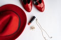 Fashionable women`s cosmetics and accessories flat lay in red color.