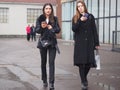 MILAN - FEBRUARY 22, 2018: Fashionable women walking in the street before LES COPINS fashion show Royalty Free Stock Photo