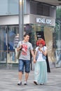 Fashionable young couple in shopping area, Beijing, China