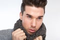 Fashionable young man posing with gray wool scarf Royalty Free Stock Photo