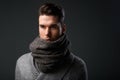 Fashionable young man posing with gray wool scarf Royalty Free Stock Photo