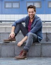 Fashionable young man smiling outdoors Royalty Free Stock Photo