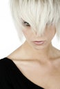 Woman peering through blonde fringe