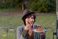 Fashionable young woman enjoying a plate of cake Royalty Free Stock Photo