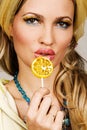 Fashionable young woman holding a candy Royalty Free Stock Photo