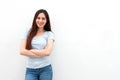 Fashionable young woman smiling with arms crossed Royalty Free Stock Photo