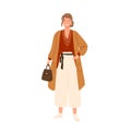 Fashionable young woman wearing trendy outfit and accessories. Female character in modern oversize clothes holding bag