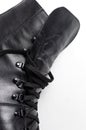 Fashionable youth black leather autumn boots on white background flat lay. Stylish womens mens unisex Grunge boots with bootlace.