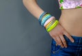 ÃÂ  Fashionable youth braided bracelets on her arm girl