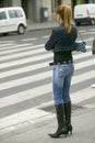 Fashionably dressed woman in black boots with high heels and tight jeans in Bilbao (Bilbo), the North Coast of Spain