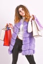 Fashionista buy clothes on black friday. Discount black friday. Shopping and gifts. Girl makeup furry violet vest Royalty Free Stock Photo