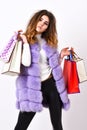 Fashionista buy clothes on black friday. Discount black friday. Shopping and gifts. Girl makeup furry violet vest Royalty Free Stock Photo