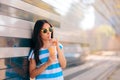 Urban Summer Fashion Woman Having a Refreshment Drink Outdoors Royalty Free Stock Photo