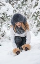 Attractive woman with brown fur cap and jacket enjoying the winter. Side view of fashionable blonde girl posing Royalty Free Stock Photo