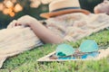 fasion sun glasses with young woman sleeping in background, vintage style Royalty Free Stock Photo