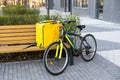 Fast bicycle courier. big yellow bag and bicycle