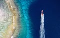 Fast boat on the sea. Aerial view of luxury floating boat on blue water at sunny day. Seascape with motorboat in bay. Royalty Free Stock Photo