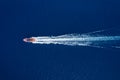 Fast boat at the sea in Bali, Indonesia. Aerial view of luxury floating boat on transparent turquoise water at sunny day. Top view Royalty Free Stock Photo