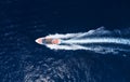 Fast boat at the sea in Bali, Indonesia. Aerial view of luxury floating boat on transparent blue water at sunny day. Summer seasca