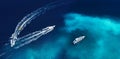 Fast boats on the sea in Bali, Indonesia. Aerial view on speed boats on blue water at sunny day. Seascape from air. Top view from Royalty Free Stock Photo