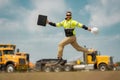 Fast building. Funny construction worker jumping. Excited jump of builders in helmet. Worker in hardhat. Construction