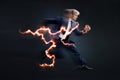 Fast business. Running businessman charged with lightning, concept