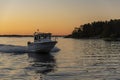 Fast cabin motorboat evening light Stockholm archipelago