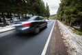 Fast car on a winter forest road Royalty Free Stock Photo