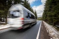 Fast car on a winter forest road Royalty Free Stock Photo