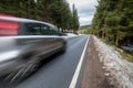 Fast car on a winter forest road Royalty Free Stock Photo