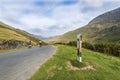 Fast cyclists road and hilly landscape Royalty Free Stock Photo