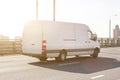 Fast delivery van drives on highway through city. commercial van is delivering cargo