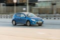 Fast drive blue car Hyundai i30 on the road. Front side view of hatchback auto in motion Royalty Free Stock Photo