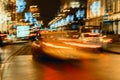 Fast driving traffic at night, neon lights. Abstract blurred background of urban moving car. Auto, city street, speed Royalty Free Stock Photo