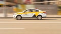 Fast driving yandex taxi car on Moscow streets in sunny day