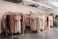 fast-fashion store, with racks of overstock dresses, shirts, and accessories