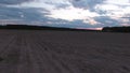 Fast flight on the drone. The sky at sunset. Empty field.