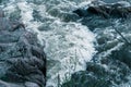 Fast flowing cold water mountain stream, flowing stormy stream stream, nature outdoors, fresh stream dark blue water Royalty Free Stock Photo