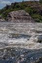 Fast flowing cold water mountain stream, flowing stormy stream stream, nature outdoors, fresh stream dark blue water Royalty Free Stock Photo