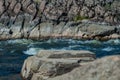 Fast flowing cold water mountain stream, flowing stormy stream stream, nature outdoors, fresh stream dark blue water Royalty Free Stock Photo