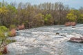 Fast flowing cold water mountain stream, flowing stormy stream stream, nature outdoors, fresh stream dark blue water Royalty Free Stock Photo