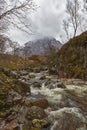 A fast flowing Highland stream tumbling down the small Valley off Rannoch Moor in the Scottish Highlands. Royalty Free Stock Photo