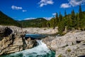 Fast flowing water rushes over the falls. Elbow Falls Provincial Recreation Area, Alberta, Canada