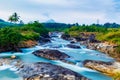 The fast flowing Waterfall located near the Pechiparai Dam The water flows over a rocky cliff. Royalty Free Stock Photo